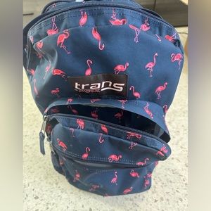 Three pocket Jansport backpacks with pink flamingo